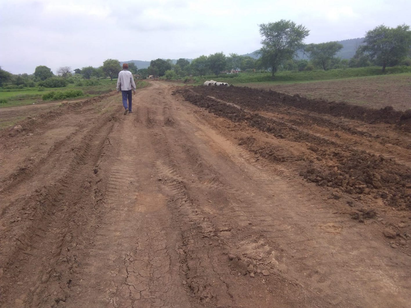 Gravel road being built by illegal mining
