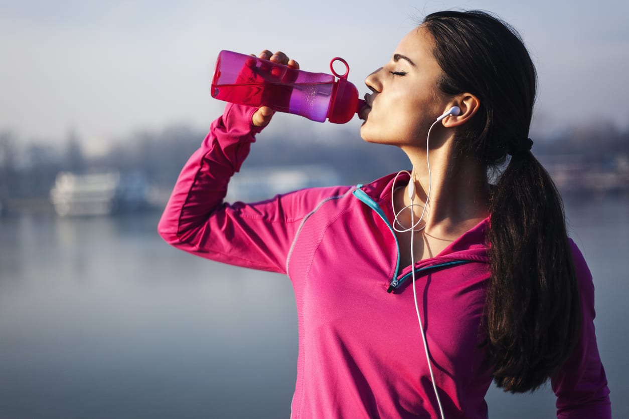 Thirsty senior male drinks water from palstic bottle, being tired after  cardio training, has active lifestyle, dressed casually, poses outdoor.  Mature man takes break after jogging. Sport, retirement Stock Photo | Adobe