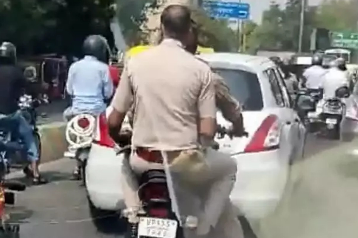 up-police-daroga-challan-of-rs-14-thousand-in-violating-4-traffic-rule.jpg