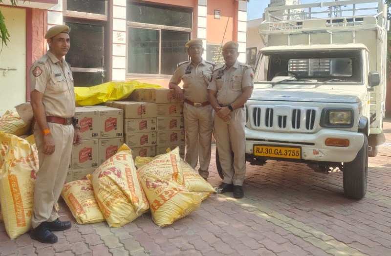 liquor being carried hidden under animal feed caught in chomu