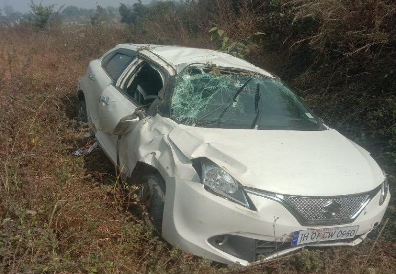 Car overturned in field