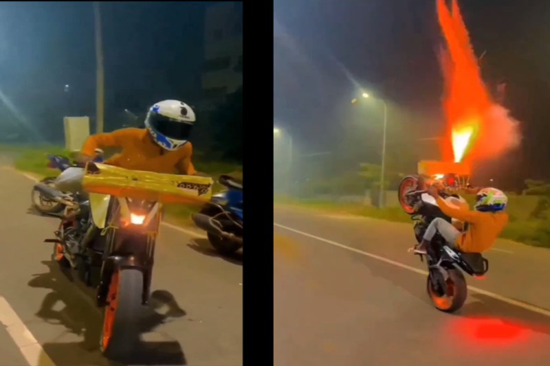 Young man showing stunt on bike