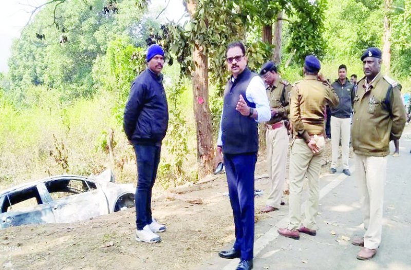 Police and forensic teams engaged in the investigation of the incident site.