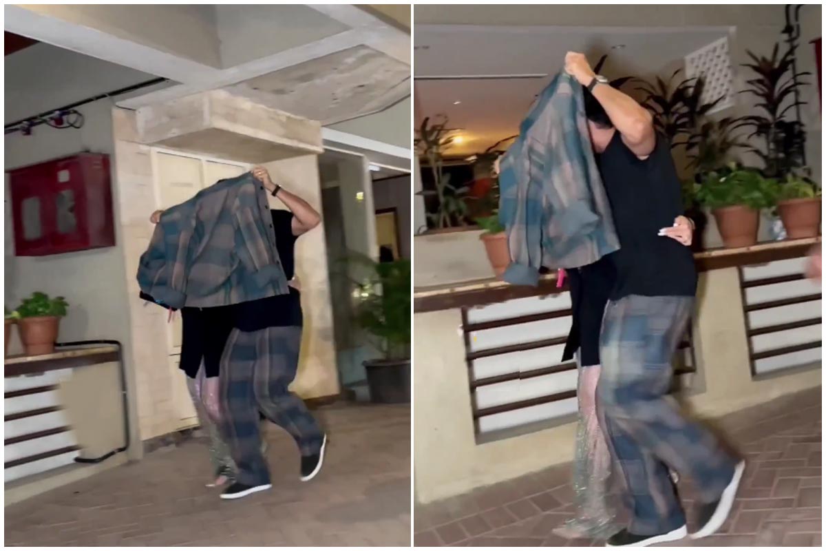 farhan_akhtar_and_amrita_arora_covering_face_by_blazer_after_came_out_kareena_kapoor_khan_house_party.jpg