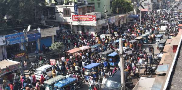 crowd of examinees at the bus stand and railway station
