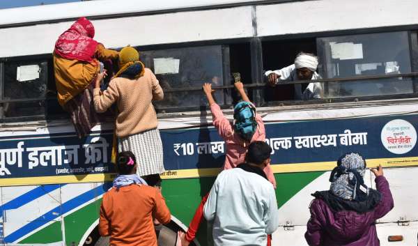 crowd of examinees at the bus stand and railway station