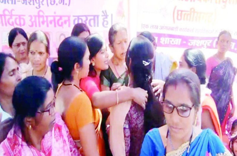 Amba workers and assistants celebrate after the announcement at the picket site.