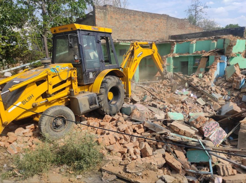 Bulldozer at house of accused who killed father and son, police arrest