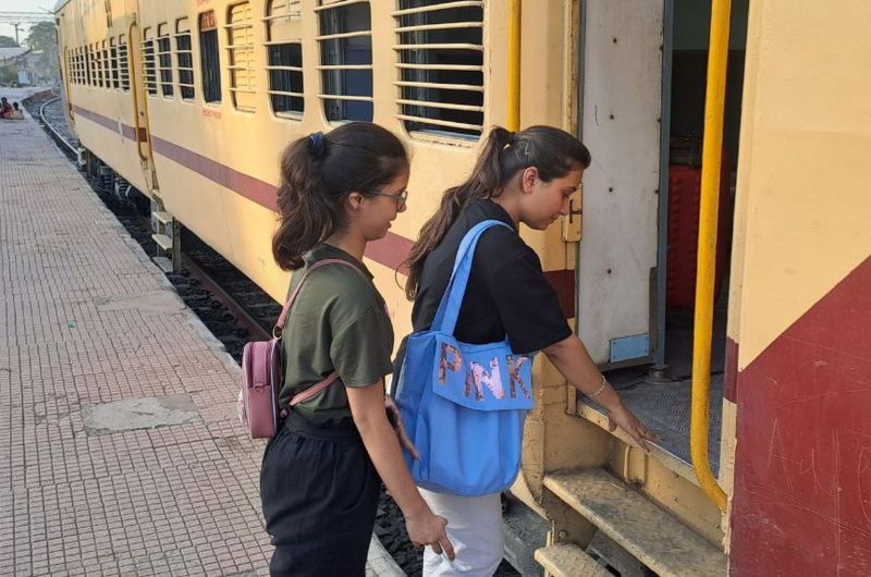 Passengers praying before boarding the train