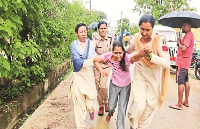 Woman warns of self-immolation with family by pouring kerosene