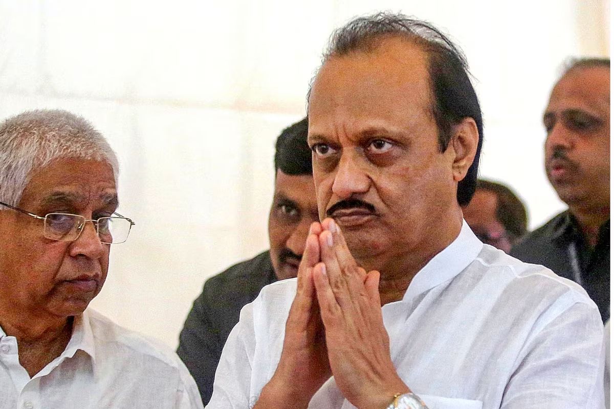 Young man hanging 60 feet in the air to welcome Ajit Pawar