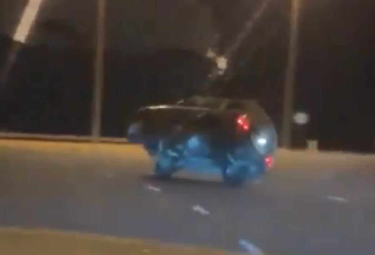 driving_car_on_2_side_wheels.jpg