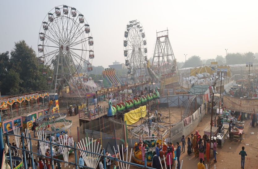 Children enjoyed the swings in the autumn fair, the fair was bustling with crowd