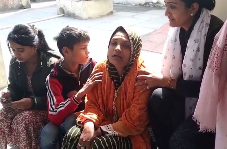 Mother crying after son's suicide