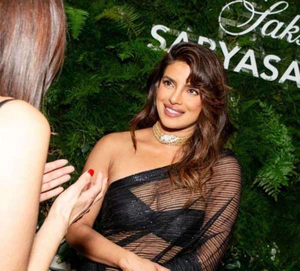 Priyanka chopra in desi girl look wore sabyasachi black transparent saree