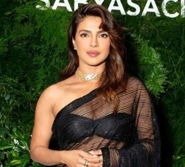 Priyanka chopra in desi girl look wore sabyasachi black transparent saree
