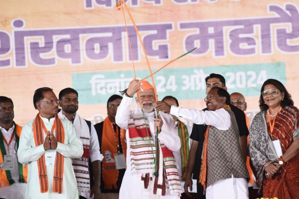 Raipur@PM Narendra Modi holding a bow and arrow in his hands during campaigning in Surguja Lok Sabha in Ambikapur.