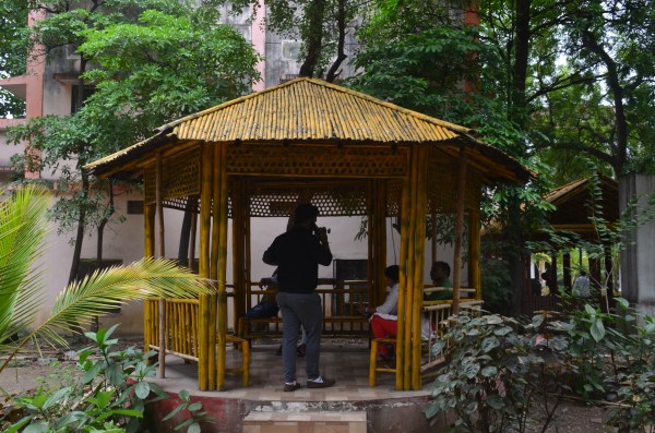 People have to stand in the sun or under a tree and wait to get their work done
