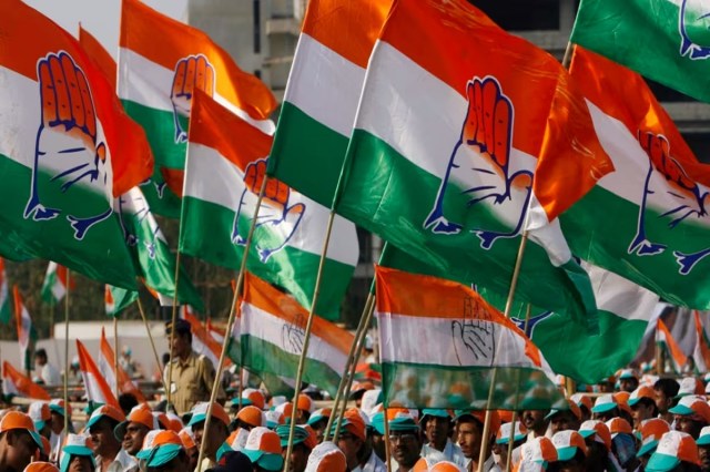 CG Politics - Congress workers raising party flag