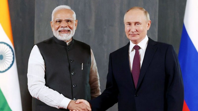 Indian Prime Minister Narendra Modi and Russian President Vladimir Putin shaking hands