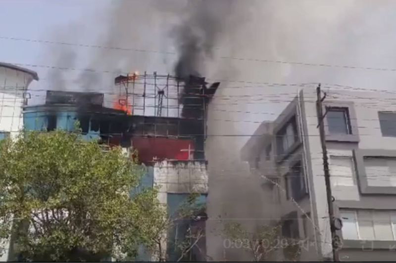 A massive fire broke out in a building in Noida a car parked in campus burn