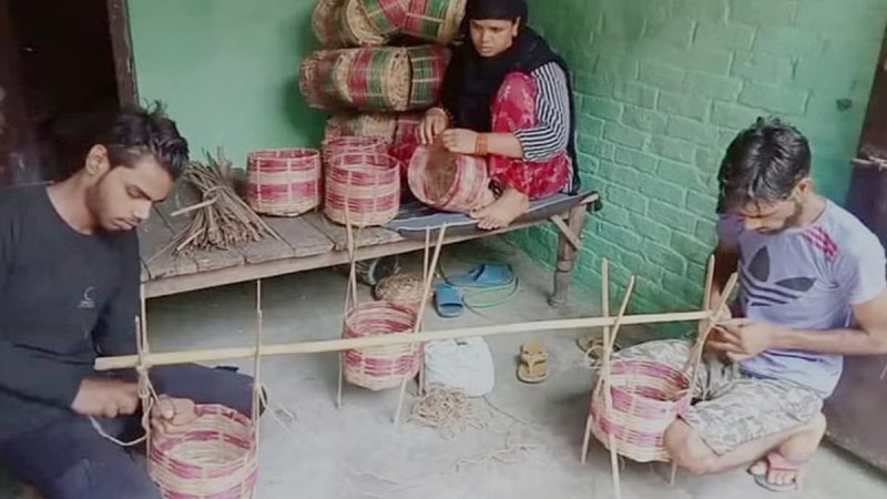Kanwar of Muslim youth being decorated on shoulders of Kanwadis in Moradabad