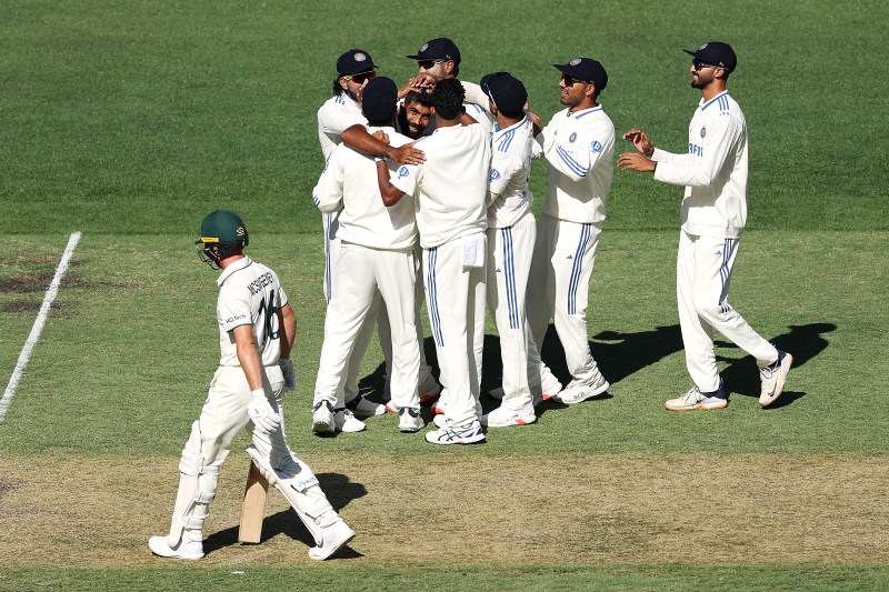 Jasprit Bumrah and teammates celebrate the wicket of Australia's Nathan McSweeney