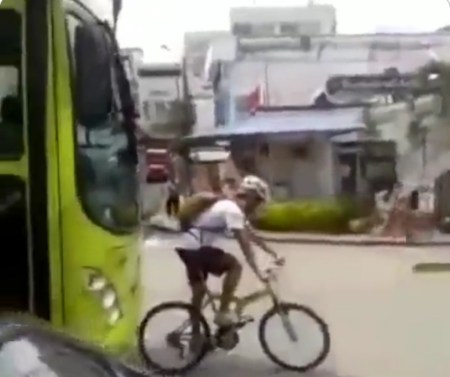 Bicycle rider blocks way of bus and finds out