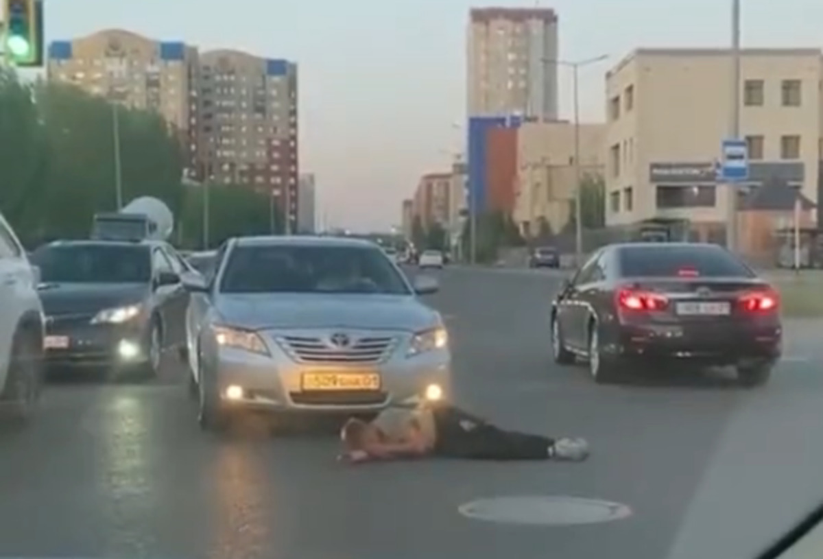 Man gets hit by car while doing stunts on road