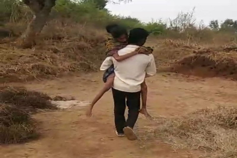 Sick wife in husband lap