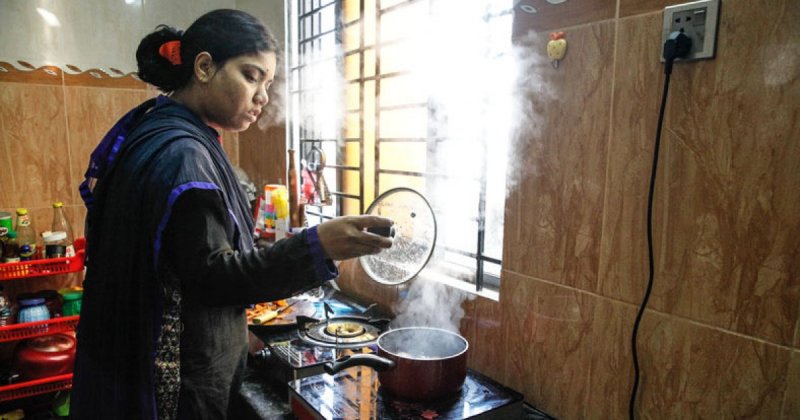Bangladeshi woman doing household chores