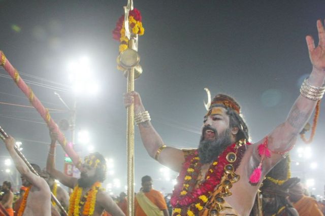 Sadhus enthusiastically proceeding towards the Sangam