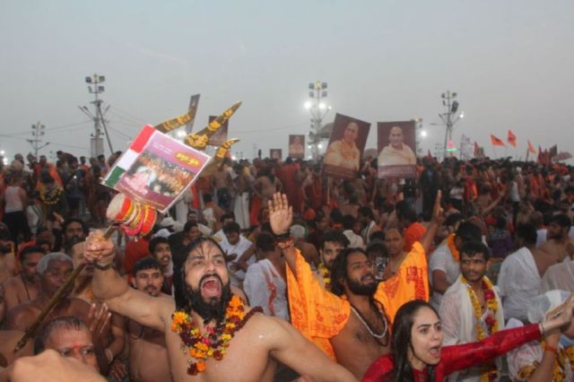 Sadhus chanting during the holy dip