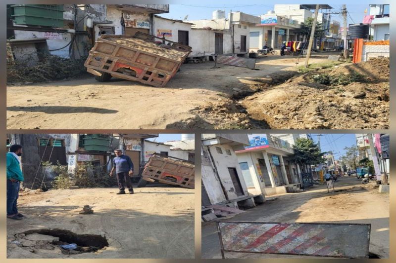 Soil being filled in the sewerage line, deep pits everywhere, tractor trolley sunk