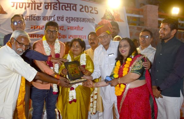 Grand procession of Gangaur with royal attire, festive cheer in the city
