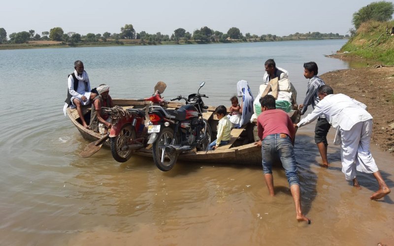 Villagers going from Alipura to Khakhora by boat
