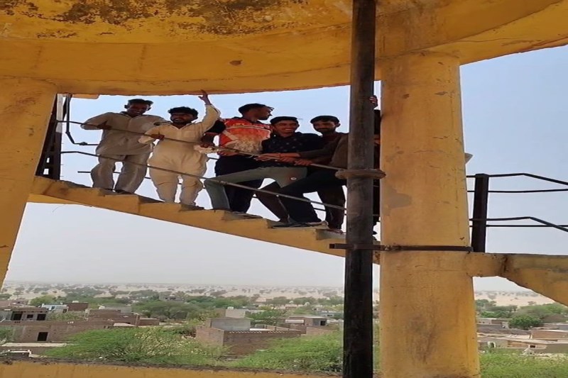 Villagers troubled by water shortage climbed on the tank