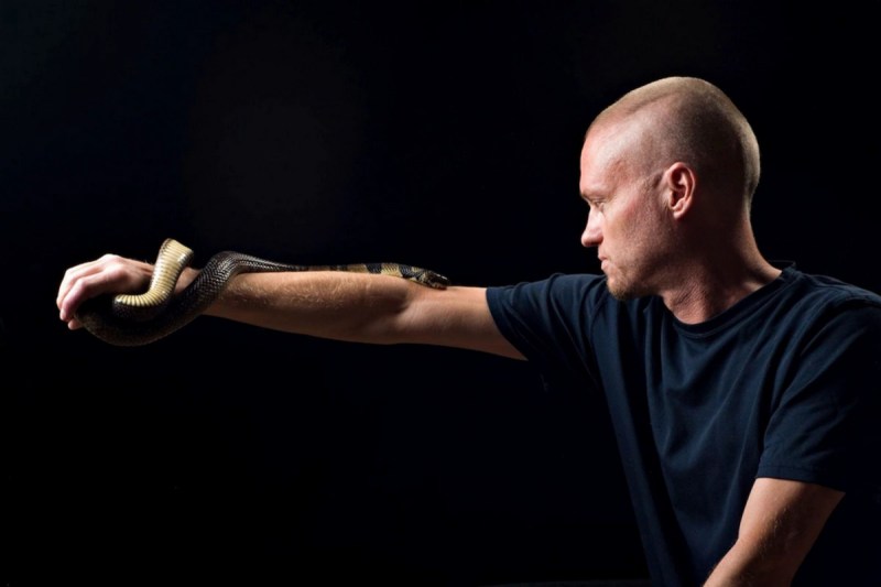 Tim Friede with snakes