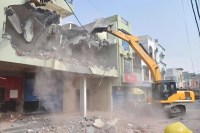 Bulldozers demolished houses