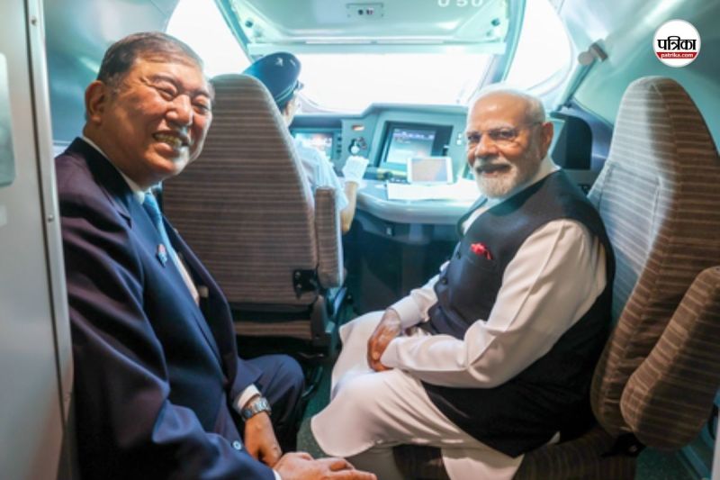 PM Modi and PM Ishiba sitting in the bullet train