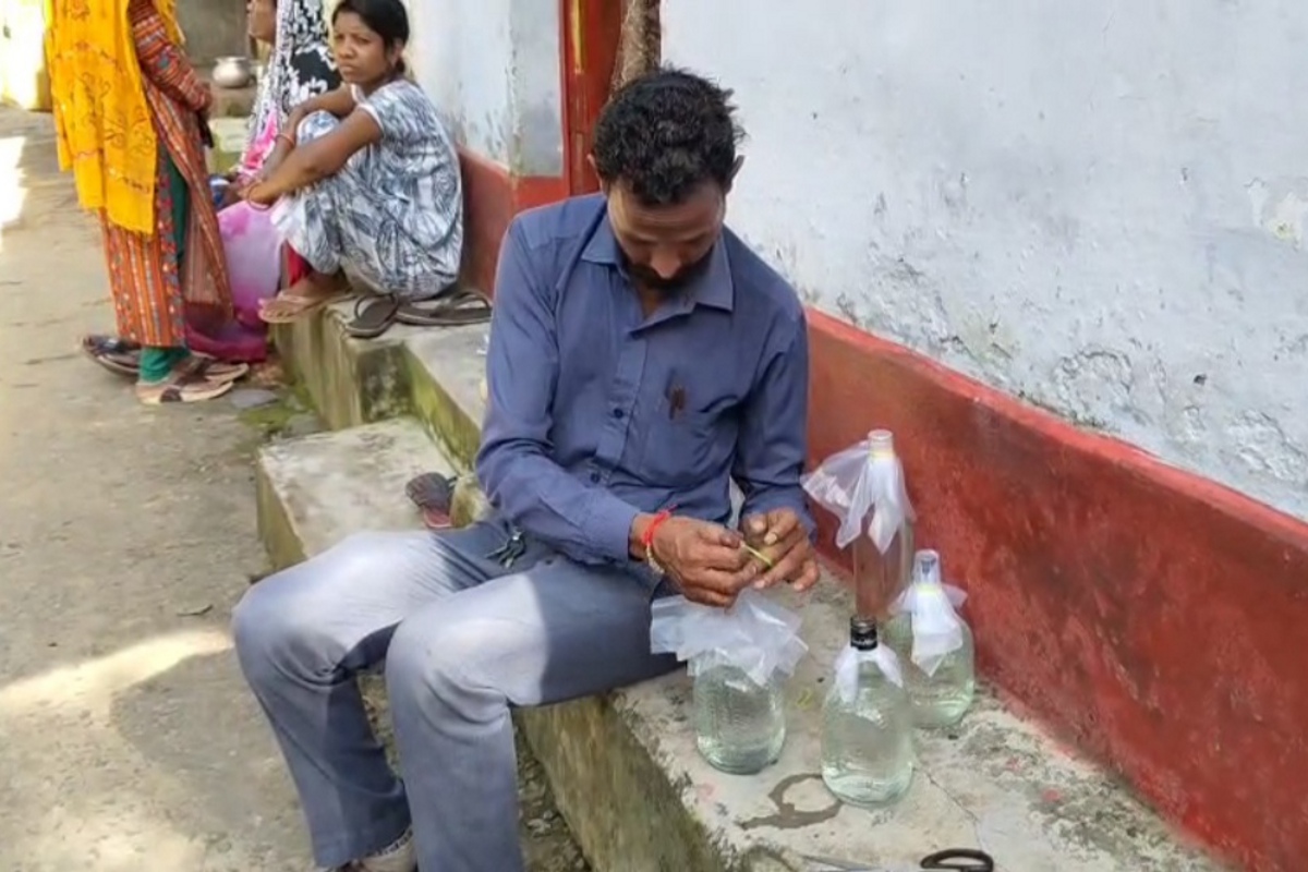 Water sample in liquor bottle