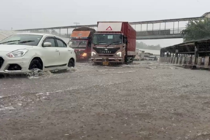 Heavy rain floods a road in Gurugram