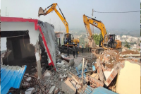 mhow janpad ceo assault case bjp leader relative llegal encroachment bulldozer action mp news