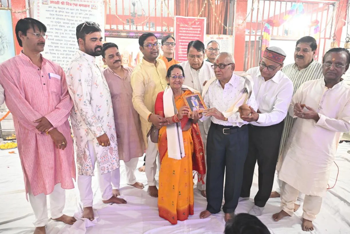 Presented Lakshmi-Ganesh coin and pen-inkpot during Chitragupta Puja