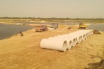 A temporary bridge was built to extract gravel from the Banas River.