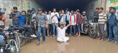 Former district president protested by sitting in the underbridge, said that the potholes should be filled soon.