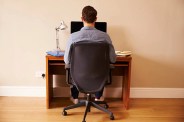 Sitting in front of computer