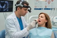 doctor checking patient