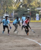 Indian hockey player showcases his skills on a muddy field