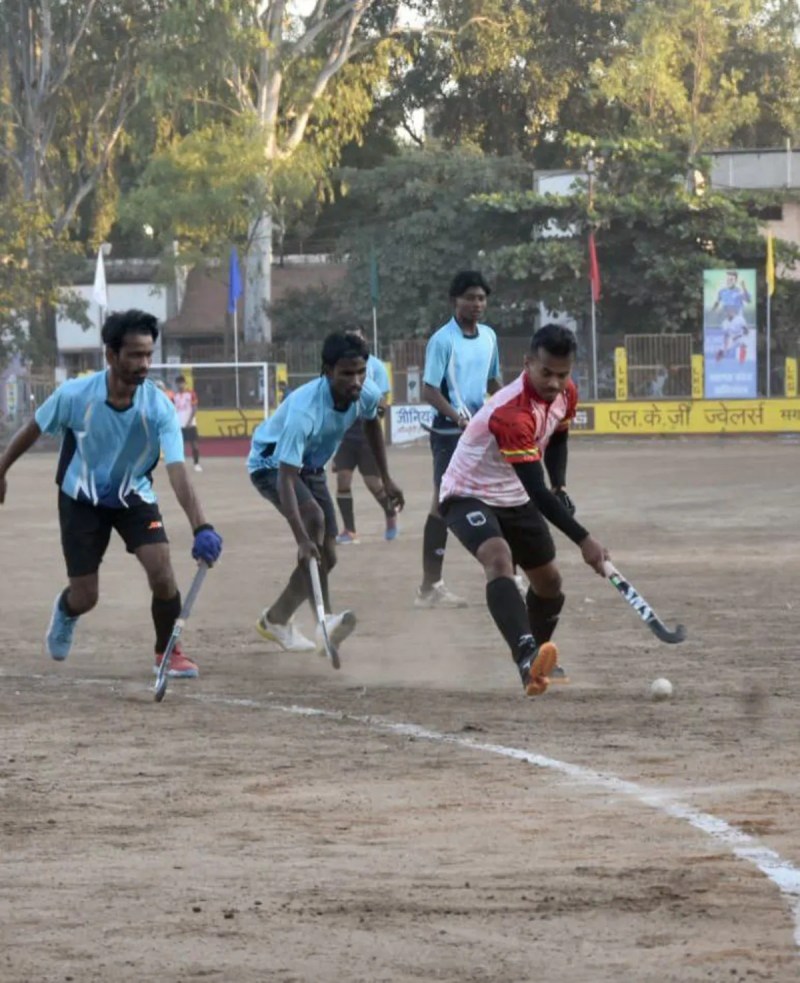 Indian hockey player showcases his skills on a muddy field